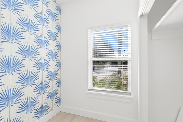 bathroom featuring baseboards and wood finished floors