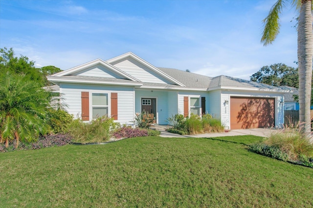 single story home featuring a front yard, an attached garage, and driveway