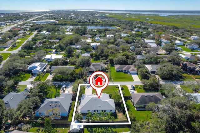 birds eye view of property featuring a residential view and a water view