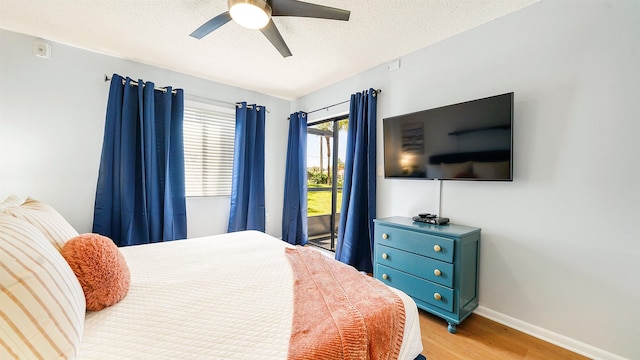 4250 A1A S B16 Unit B16, Saint Augustine, FL 32080 - bedroom featuring light wood-type flooring, access to outside, a ceiling fan, and a textured ceiling