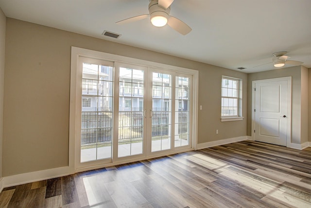 doorway to outside featuring ceiling fan and light wood-type flooring