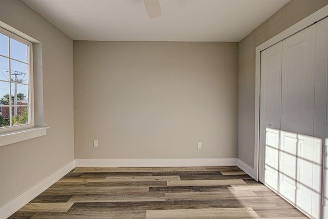 empty room featuring ceiling fan and hardwood / wood-style floors