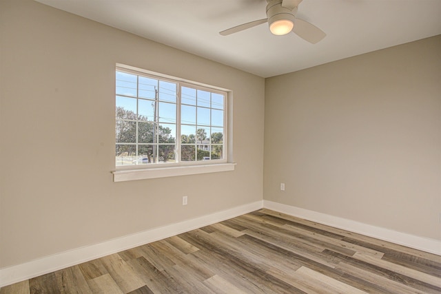 unfurnished room with light hardwood / wood-style floors and ceiling fan