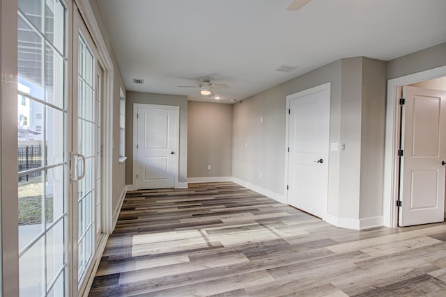 spare room with light hardwood / wood-style flooring and ceiling fan