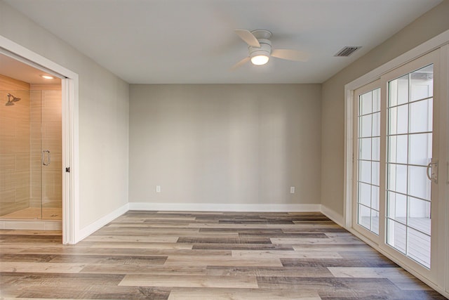 spare room featuring ceiling fan and light wood-type flooring