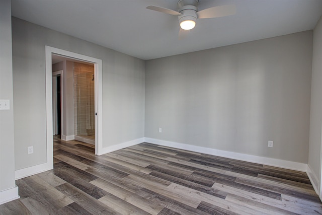 empty room with hardwood / wood-style flooring and ceiling fan