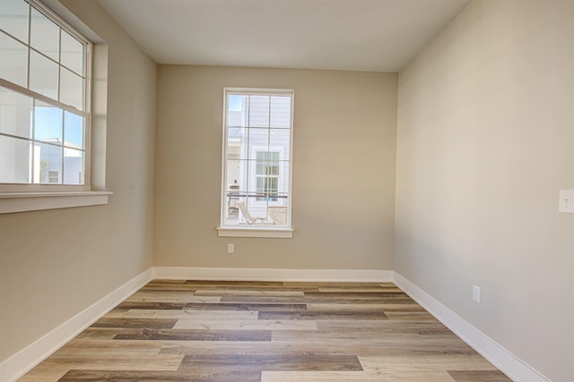 empty room with light wood-type flooring