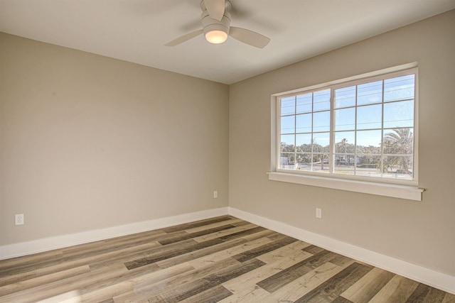 empty room featuring ceiling fan and light hardwood / wood-style flooring