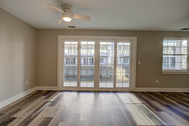 doorway to outside with ceiling fan and hardwood / wood-style floors