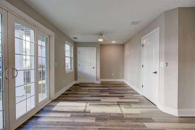 interior space featuring light hardwood / wood-style flooring, french doors, and a healthy amount of sunlight