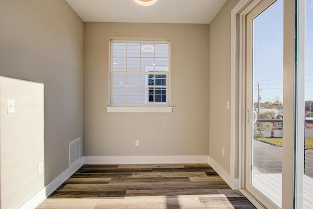 empty room featuring dark hardwood / wood-style floors