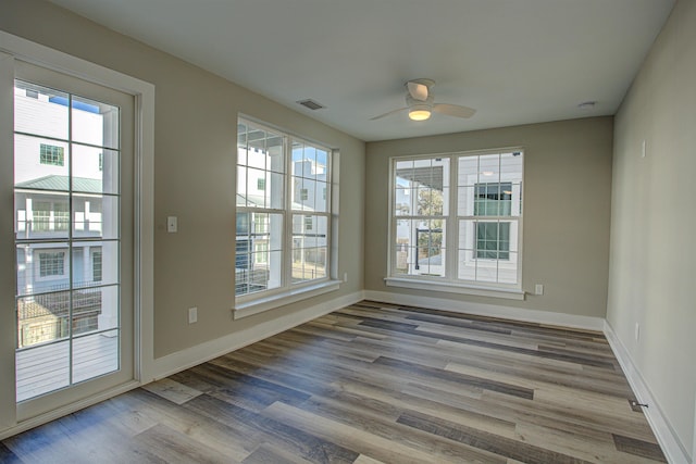 interior space with hardwood / wood-style flooring and ceiling fan