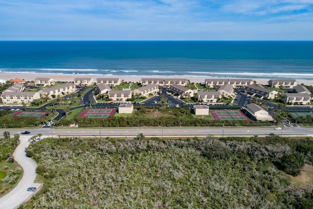 bird's eye view with a water view and a view of the beach