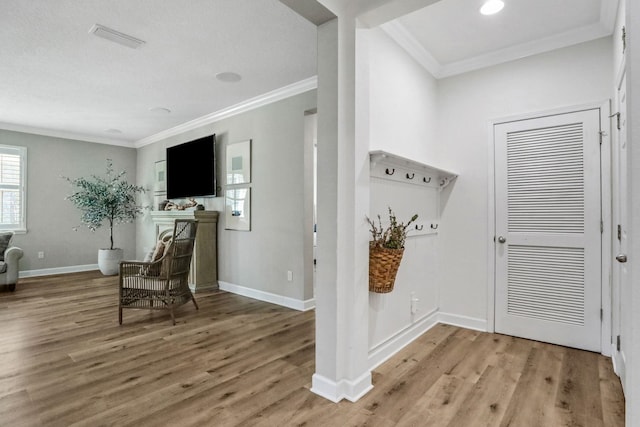 119 Duck Pond Dr, Saint Augustine, FL 32086 - interior space featuring baseboards, wood finished floors, a fireplace with flush hearth, and ornamental molding