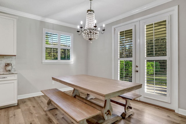 119 Duck Pond Dr, Saint Augustine, FL 32086 - dining space with a chandelier, light wood-type flooring, baseboards, and ornamental molding