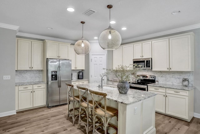119 Duck Pond Dr, Saint Augustine, FL 32086 - kitchen featuring a sink, visible vents, appliances with stainless steel finishes, and crown molding