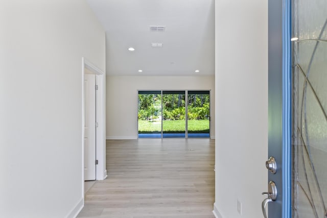 corridor featuring light hardwood / wood-style flooring