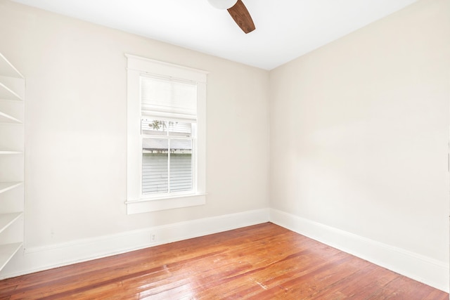 empty room featuring hardwood / wood-style flooring and ceiling fan