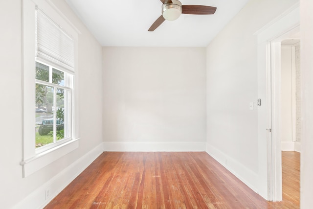 unfurnished room featuring hardwood / wood-style floors and ceiling fan