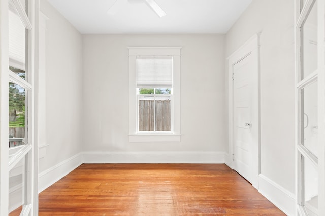 unfurnished bedroom with wood-type flooring and ceiling fan