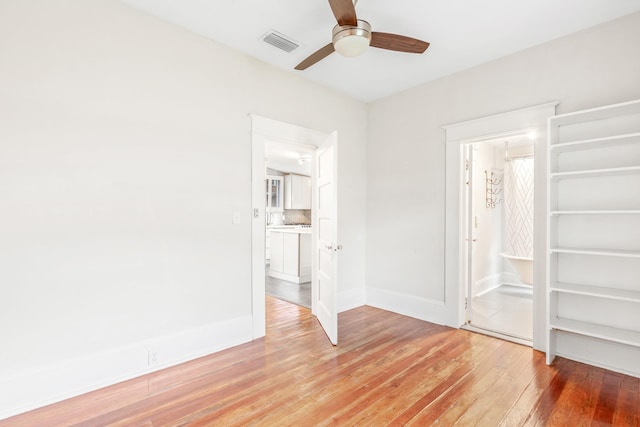 unfurnished bedroom featuring ceiling fan and hardwood / wood-style floors