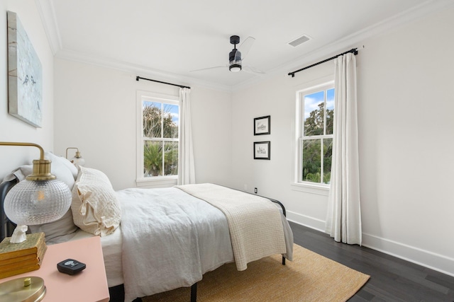 bedroom with multiple windows, crown molding, dark hardwood / wood-style flooring, and ceiling fan