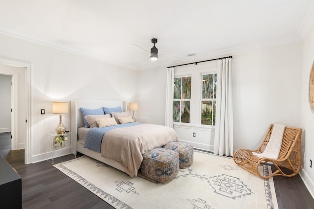 bedroom with crown molding, ceiling fan, and dark hardwood / wood-style floors