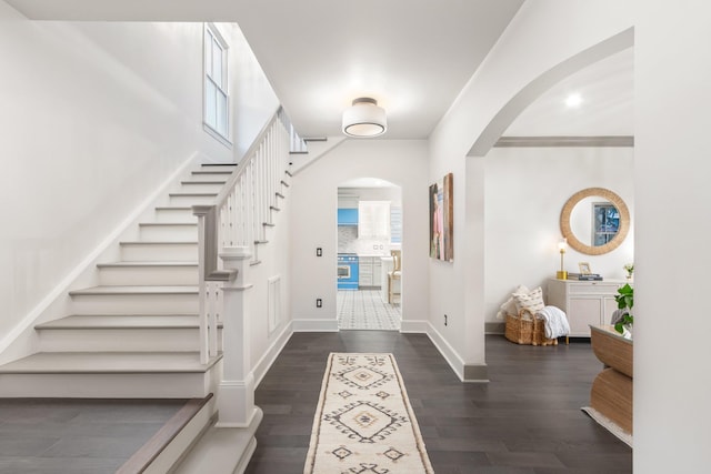 entrance foyer with dark hardwood / wood-style flooring