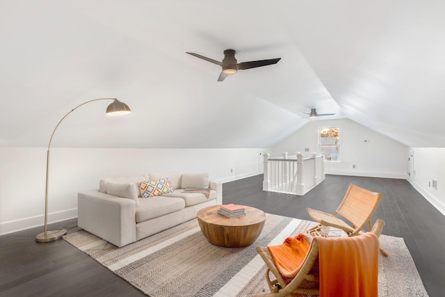 living room featuring lofted ceiling and dark hardwood / wood-style floors