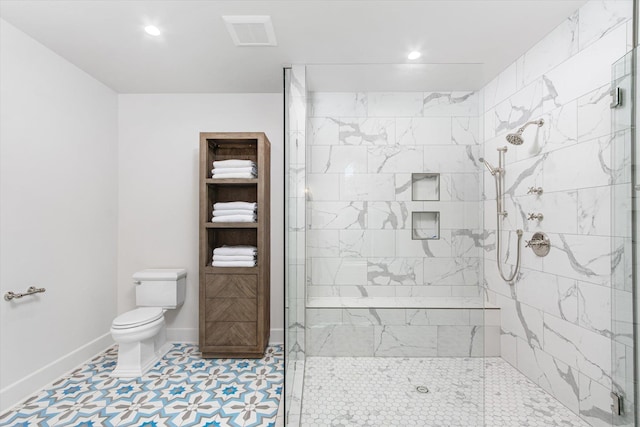 bathroom with an enclosed shower and toilet