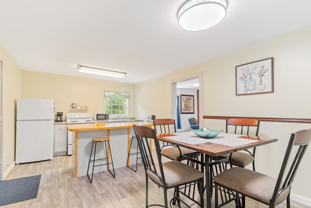 dining area featuring light hardwood / wood-style floors