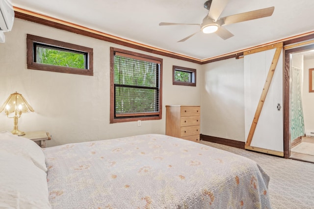 bedroom featuring ceiling fan, carpet floors, crown molding, and a wall mounted AC