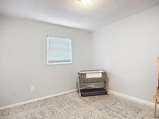 interior space featuring a textured ceiling