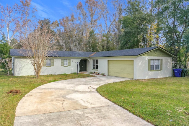 single story home with a garage and a front yard