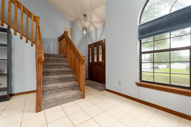 4109 Pine Run Cir, Saint Augustine, FL 32086 - foyer with stairway, lofted ceiling, and baseboards
