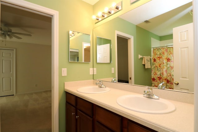 5850 Cypress Estates Dr, Elkton, FL 32033 - bathroom featuring double vanity, a ceiling fan, and curtained shower