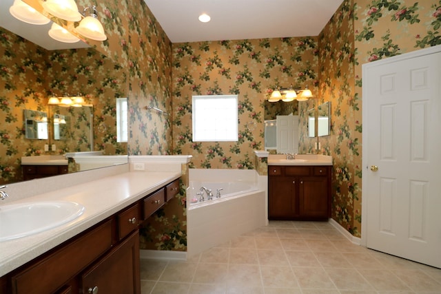 5850 Cypress Estates Dr, Elkton, FL 32033 - bathroom featuring wallpapered walls, two vanities, a garden tub, baseboards, and tile patterned floors