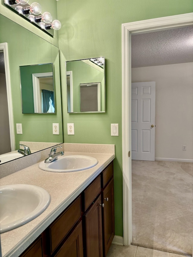 5850 Cypress Estates Dr, Elkton, FL 32033 - bathroom featuring double vanity and baseboards