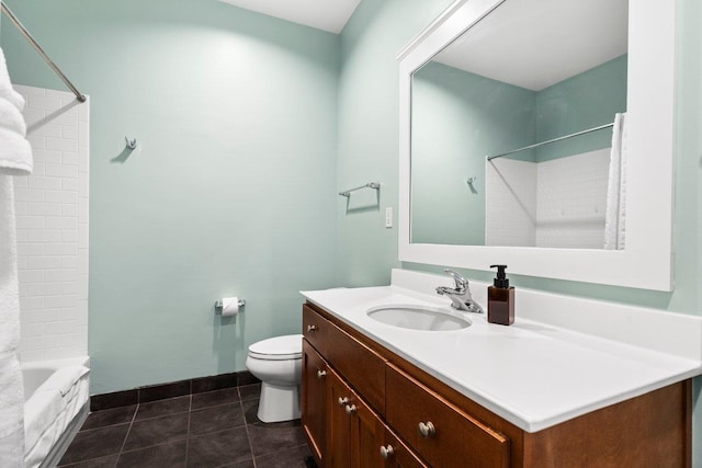 full bathroom featuring tub / shower combination, vanity, toilet, and tile patterned floors