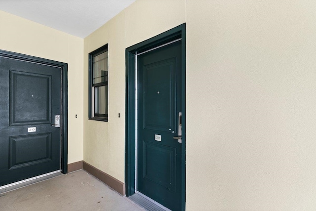 entrance to property with stucco siding