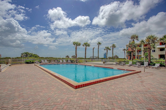 view of swimming pool with a patio