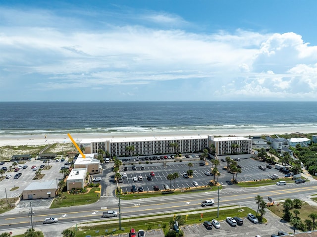 aerial view featuring a water view and a beach view