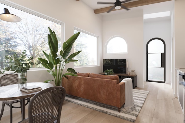 53 Hernandez Ave, Palm Coast, FL 32137 - living area featuring light wood-style flooring, beam ceiling, and ceiling fan