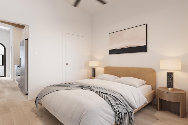 53 Hernandez Ave, Palm Coast, FL 32137 - bedroom featuring light wood-type flooring and stainless steel fridge with ice dispenser
