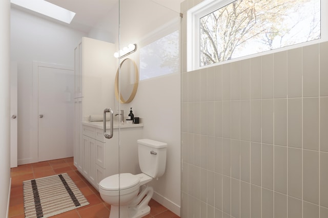 53 Hernandez Ave, Palm Coast, FL 32137 - bathroom featuring tile patterned flooring, a skylight, and toilet