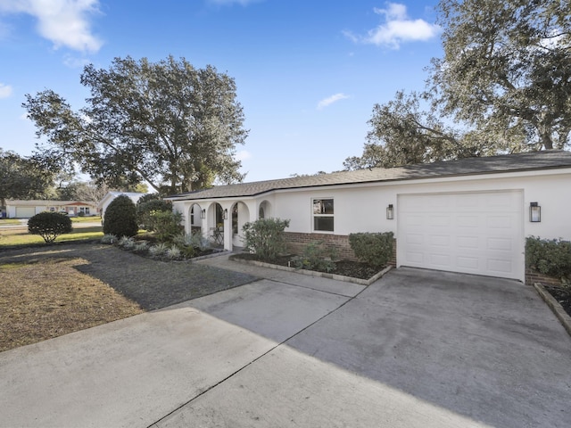 ranch-style home featuring a garage