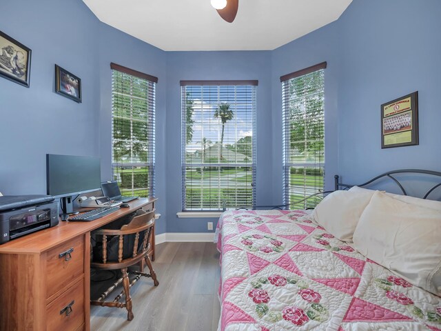 1201 Ellington Ct, Saint Augustine, FL 32084 - bedroom featuring wood finished floors, a desk, and a ceiling fan