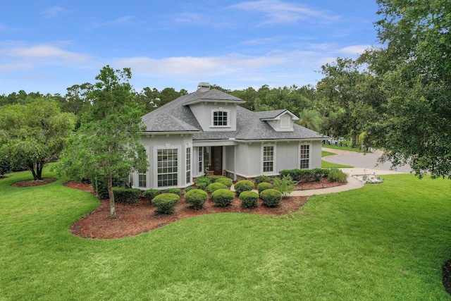 1201 Ellington Ct, Saint Augustine, FL 32084 - french provincial home featuring stucco siding, a shingled roof, and a front yard