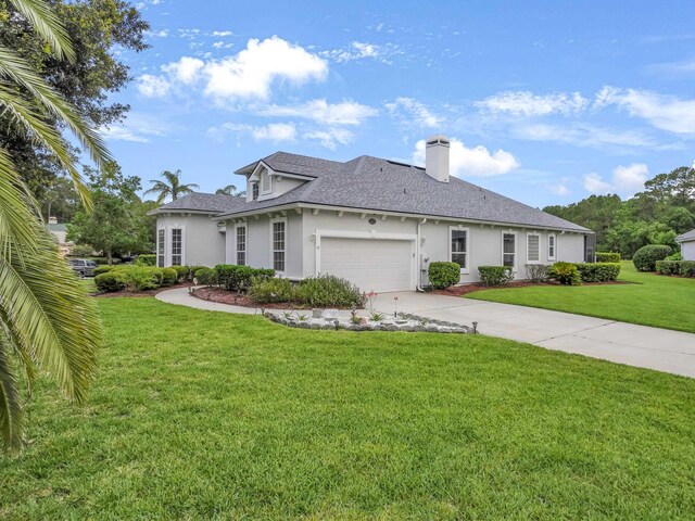 1201 Ellington Ct, Saint Augustine, FL 32084 - ranch-style house featuring stucco siding, concrete driveway, a front yard, an attached garage, and a chimney