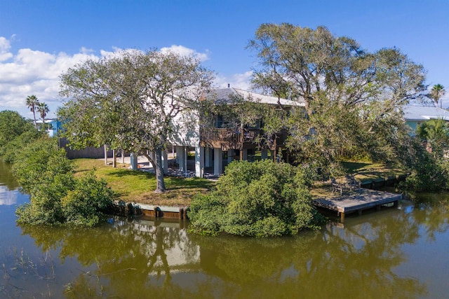 6698 Nassau St, Saint Augustine, FL 32080 - dock area featuring a deck with water view and a lawn